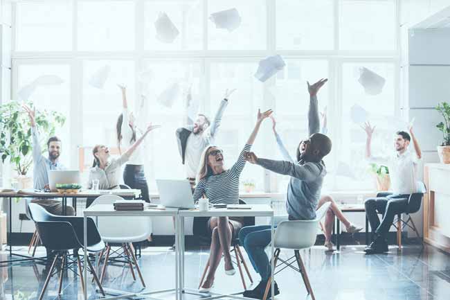 manage passion successful team millennials - Celebrating success. Group of young business people throwing documents and looking happy while sitting at their working places in office.